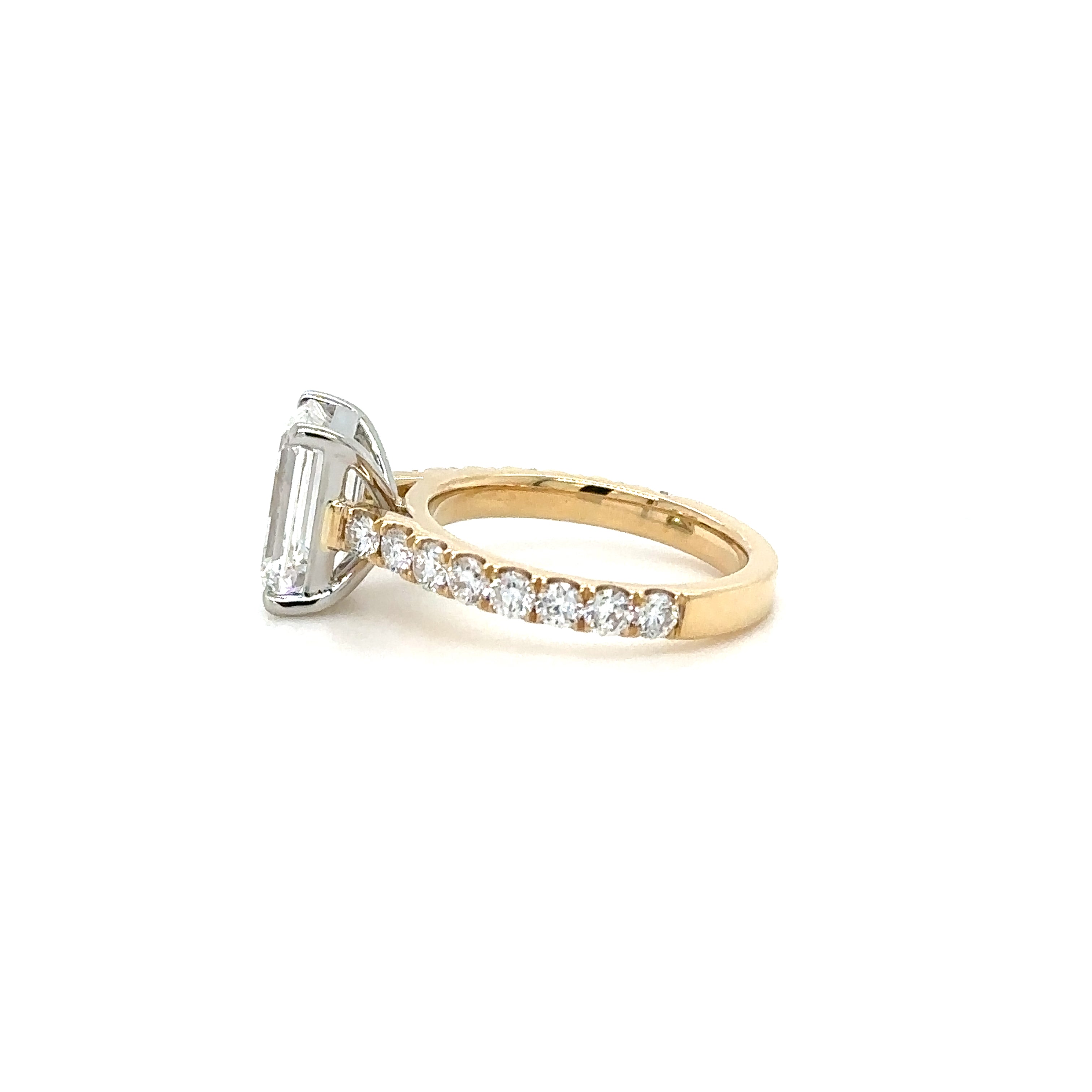 2.2ct Emerald Cut Diamond Ring Set in a 2.5mm Pave gallery diamond ring. Side View. Cairn Diamonds.