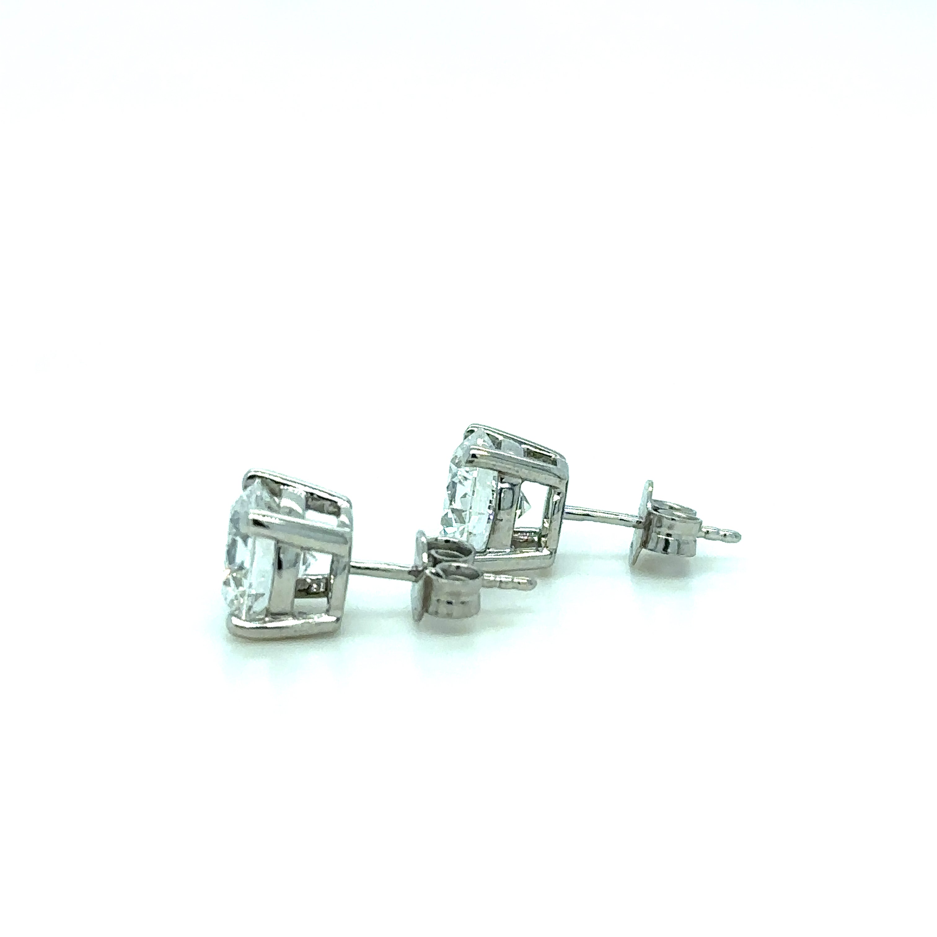 Natural Diamond Stud Earrings 4ct Total in Platinum. Side View.