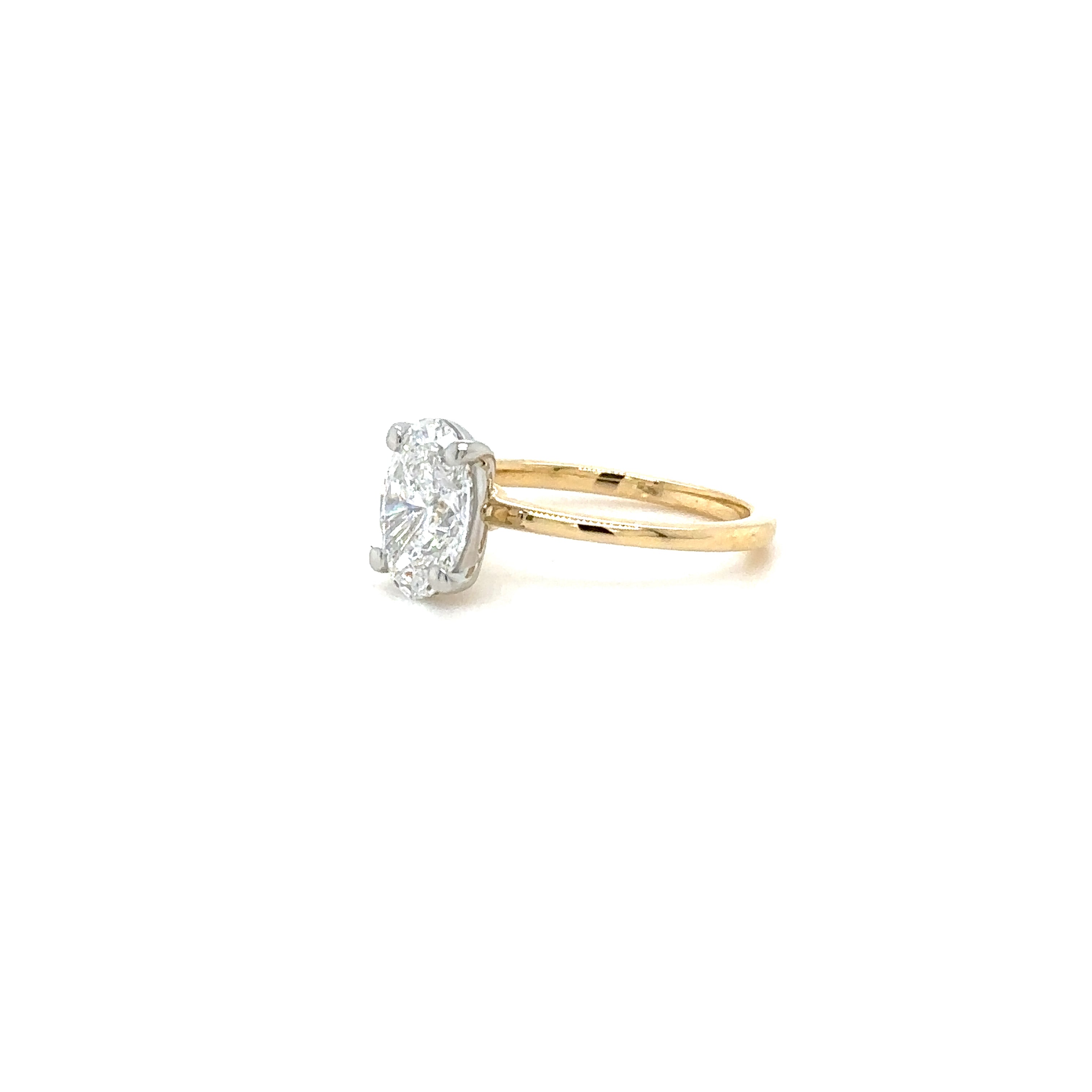 1.6mm Lowest Solitaire Diamond Engagement Ring, Oval cut. Partial Side View. Cairn Diamonds