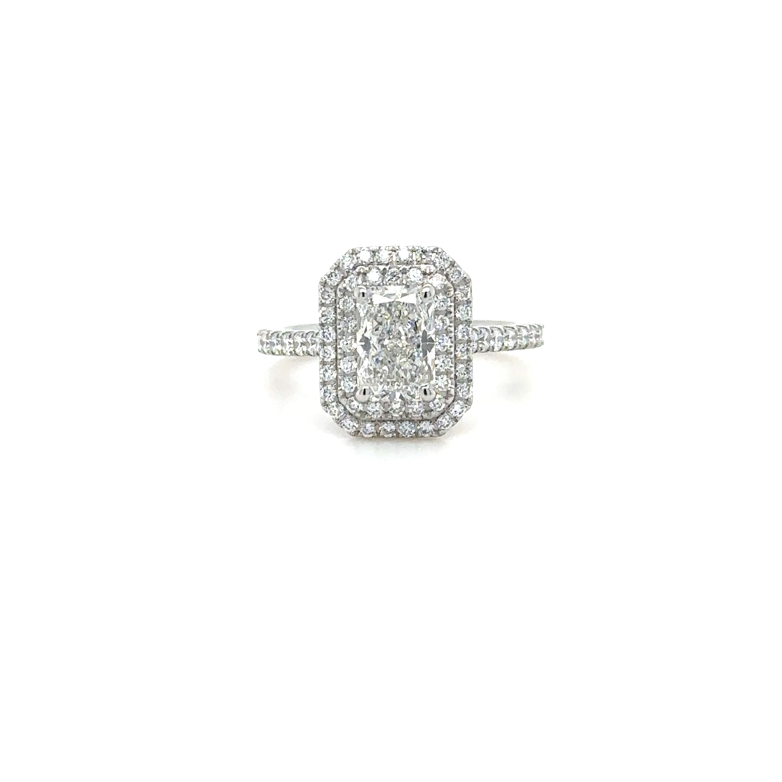 A double halo pave diamond ring with a 2mm wide band, set with diamonds